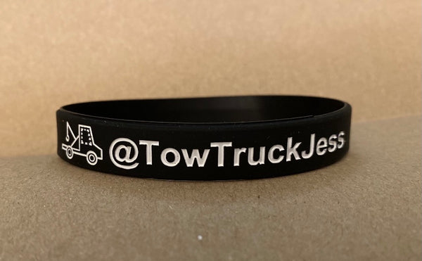A FREE Bracelet with Tow Truck Jess Sittin’ Here Thinkin’ White T-Shirt with Black Logo